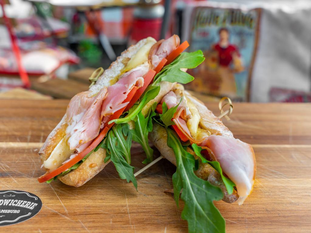 Paris Ham Sandwich  · Ham, tomatoes, arugula, melted brie cheese, mayo and organic baguette bread.