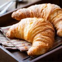 Croissant · Soft and flakey croissant made with layer upon layer of buttery dough.