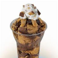 Reese's Peanut Butter Cup Layered Sundae · 3 scoops of Reese's peanut butter cup ice cream topped with Reese's peanut butter cups, pean...