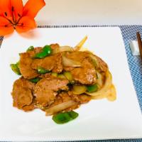 V11.Mock Pepper Steak with Onion · Stir fried steak with vegetables and a savory sauce.