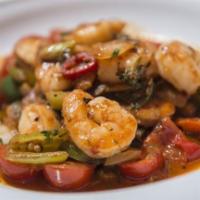 Shrimp Saltado · Sauéed Shrimp, sautéed onions, tomatoes, spring onions, cilantro, served on a bed of French ...