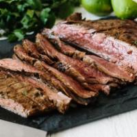 Carne Asada · Grilled sirloin steak platter, served with two sides.