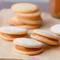 Alfajor · Cookie sandwich with a layer of dulce de leche in between two biscuits, sprinkled with powde...