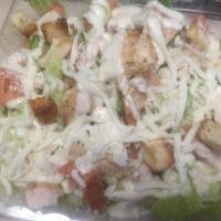 Chicken Caesar Salad · Grilled chicken over fresh romaine lettuce with tomatoes, croutons and Caesar dressing.
