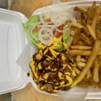 Texas Burger Deluxe · BBQ sauce, cheddar cheese and onion rings. Served with lettuce, tomato, onion, coleslaw and ...