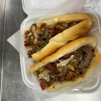 Small King Cheesesteak · Onions, mushrooms, green peppers, pepperoni, American cheese and sauce. Served with potato c...
