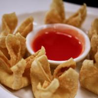 Crab Rangoon (6) · Cream cheese blended with green onions and diced imitation crab meat  in a crisp wonton