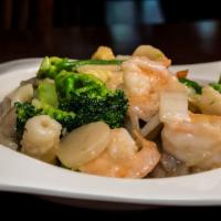Seafood Deluxe · Shrimp, scallops, squid, crabmeat, and vegetables sauteed in a light sauce.
