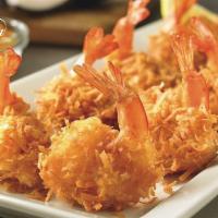 A6. Tom Chien Bot · Deep-fried shrimp - Tiger Prawns fried in coconut flakes tossed with panto breadcrumbs, serv...