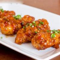 A8. Canh Ga Chien Nuoc Mam · Caramelized sweet chili fish sauce crispy chicken wings