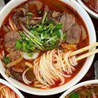 D11. Bun Bo Hue  · Spicy beef noodle soup.