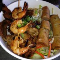 B1. Bun Tom Thit Nuong Cha Gio · Grilled shrimp, charbroiled pork, and spring rolls served with vermicelli noodle and fish sa...