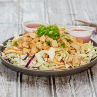 Egg Roll in a Bowl Salad · Seasoned chicken on a bed of shredded cabbage, carrots, green onion & almonds topped with cr...