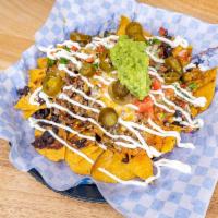 Nachos with Meat · Choice of meat, served with black or pinto beans, Jack and cheddar cheese topped with pico d...