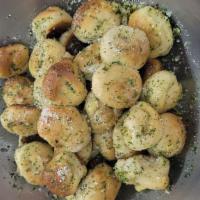 Garlic Knots · 6 pieces. Rolled baked garlic bread. 