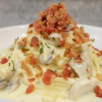 DW3. Gotji's Carbonara · Pasta cream sauce with onion, bacon, mushroom, egg yolk, Parmesan and parsley.