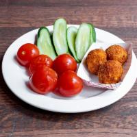 Devil's twist · 5 pieces of Spicy Kiev Bites with a side of pickled veggie. The perfect pair. Includes a can...