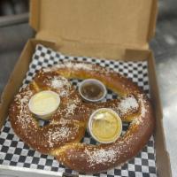 Pretzilla · Served with maple peanut butter, queso cheese sauce and horseradish mustard dipping sauces.