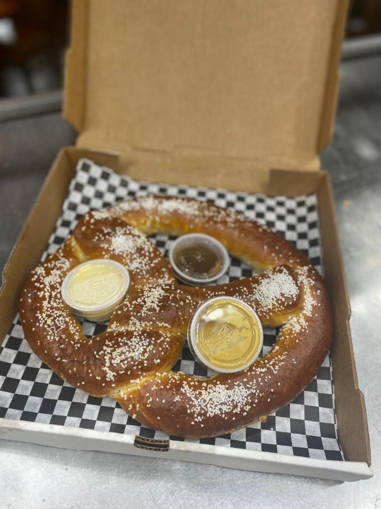 Pretzilla · Served with maple peanut butter, queso cheese sauce and horseradish mustard dipping sauces.