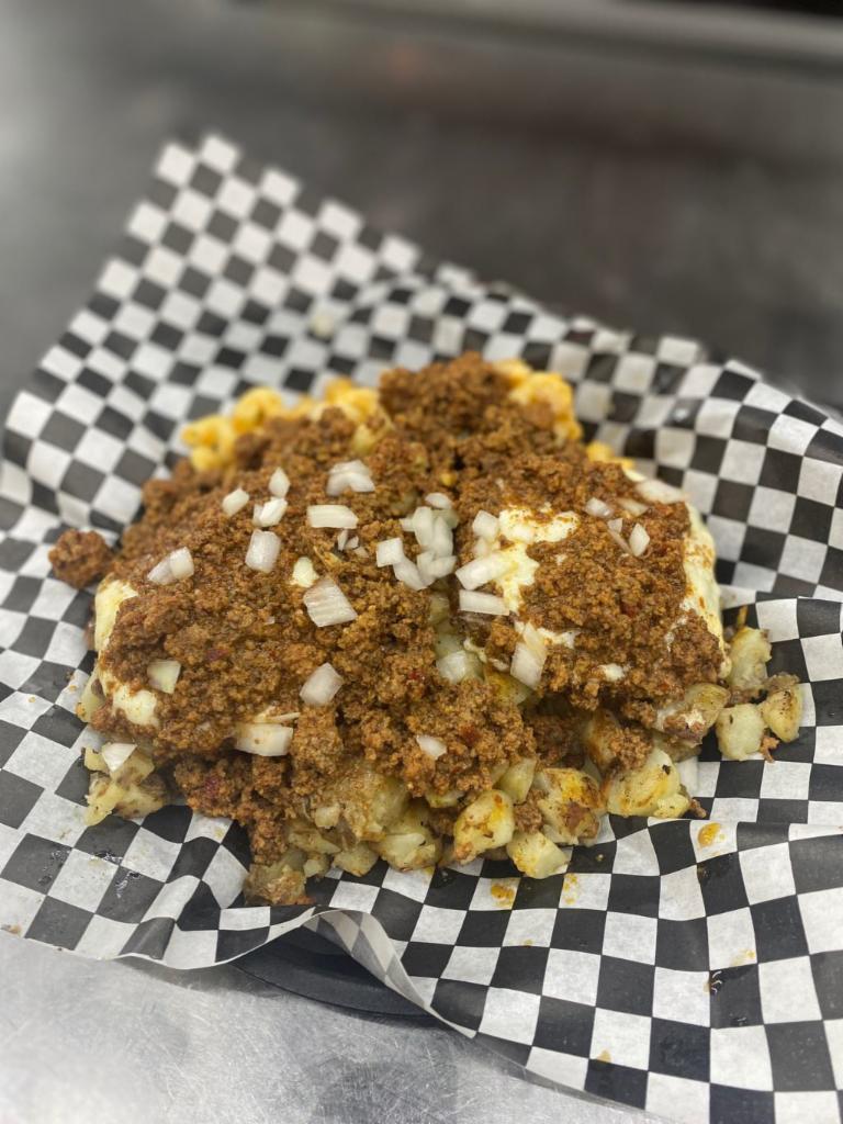 The Pen-Ster Plate · Two Cheeseburgers Piled Over a Mound of Battered French Fries & Macaroni Salad Topped with Diced Onions & Smothered in our own Signature Meat Hot Sauce.