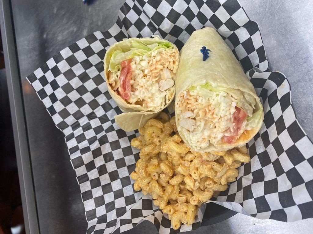 Buffalo Chicken Wrap · Grilled Seasoned Chicken Breast with Buffalo Sauce, Mozzarella Cheese, Crispy Lettuce, Tomato and Your Choice of Ranch or Blue Cheese Wrapped in a Soft Flour Tortilla.