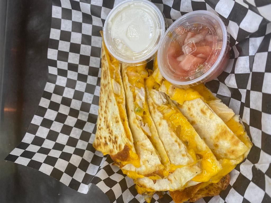 Signature STUFFED Quesadilla (Cheese or Chicken) · Seasoned Grilled Chicken Smothered with Melted Shredded Cheddar Cheese, Grilled Onions and Sweet Peppers Between a Tortilla. Comes with Sides of House Salsa Fresca and Sour Cream

