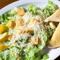 Caesar Salad · Fresh topped romaine lettuce tossed with Parmesan cheese and Caesar dressing served with war...