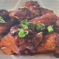 Chicken Wings · 5 pieces. Deep-fried chicken wings served with sweet and sour sauce.