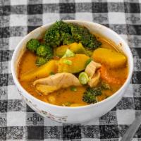 Pumpkin curry · Red curry with pumpkin, bell peppers, broccoli, carrot, basil.Served with steamed rice 
