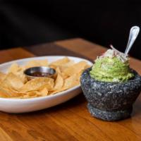 Guacamole & Chips · Housemade guacamole topped with radish and Oaxaca cheese. Served with housemade tortilla chi...