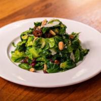Brussels Sprouts Salad · Blanched Brussels Sprouts leaves are tossed with house-made mustard vinaigrette with medjool...