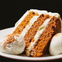 Carrot Cake · A must-have at Hub! Our mom's famous recipe - three layers of moist carrot cake layered with...