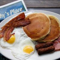 Lumber Jack Breakfast · 2 pancakes with ham, bacon, sausage and 2 eggs any style.