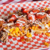 Maniac Fries · Loaded with mac and cheese, hot links with choice of brisket, pork or smoked chicken.