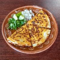 Quesadilla · Cooked tortilla that is filled with cheese and birria folded in half. 