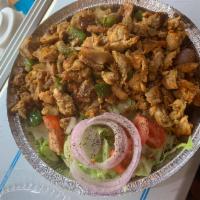 36. Chicken over Rice · Lettuce, tomato, onion, green peppers, white sauce, hot sauce and BBQ sauce.