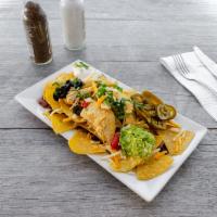 Chicken Nachos · Chips with cheese and a variety of toppings.