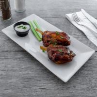 Pork Wings · Cooked wing of a chicken coated in sauce or seasoning.