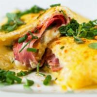 The California Omelet · Ham, tomatoes, peppers and creamy cheddar cheese.