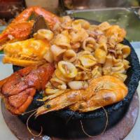 Molcajete de Mariscos  · Warm bowl loaded with scallops, fish, shrimp, crab, lobster, calamari, mushrooms, peppers an...