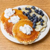 Pancakes with Fresh Fruit Breakfast · Flat sweet cake.