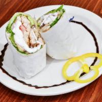 Chicken Caesar Salad Wrap · A tortilla wrap overstuffed with crisp romaine lettuce, tossed with creamy Caesar dressing.