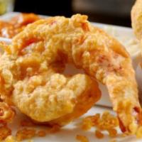 Jumbo Shrimp and Chips · Golden crispy jumbo shrimps fried to a crisp dipped in a beer batter served with homemade ta...