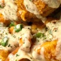 FRIED LOBSTER ALFREDO · CRISPY FRIED LOBSTER CHUNKS ON TOP OF A BED OF LINGUINE NOODLES SAOKED IN ERBASTONEZ VERY OW...
