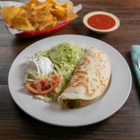 Quesadilla Mexicana · A flour tortilla grilled and stuffed with beans, cheese, and your choice of chopped beef or ...