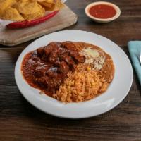 Chile Colorado · Beef chunks in a delicious red chile sauce. Served with beans, rice and corn or flour tortil...