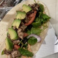 Jerk Chicken Avocado Spinach Wrap · Jerk Chicken, Avocado, Spinach, tomatoes, red peppers, onions, black olives & jerk sauce