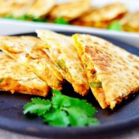 Q2. Jack Cheese and Chicken Quesadilla · Made with 2 fresh flour tortillas stuck together with melted cheese. Served with salsa on th...