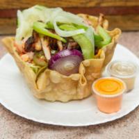 11. Grilled Chicken Tostada Salad · Served in a crispy fresh flour tortilla with iceberg lettuce, jalapeno, tomato, cucumber, le...