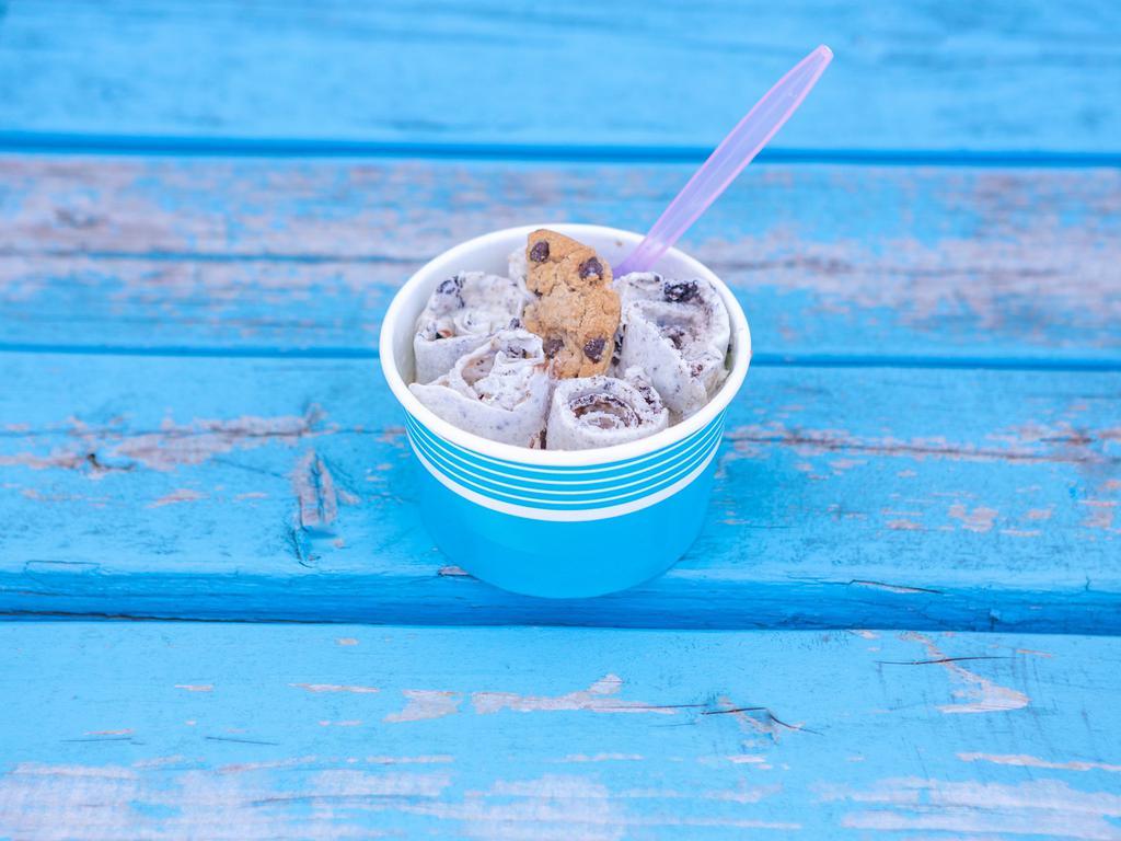 Cookie Monster Ice Cream · Vanilla ice cream, Oreos, chocolate chip cookies, and chocolate drizzle.